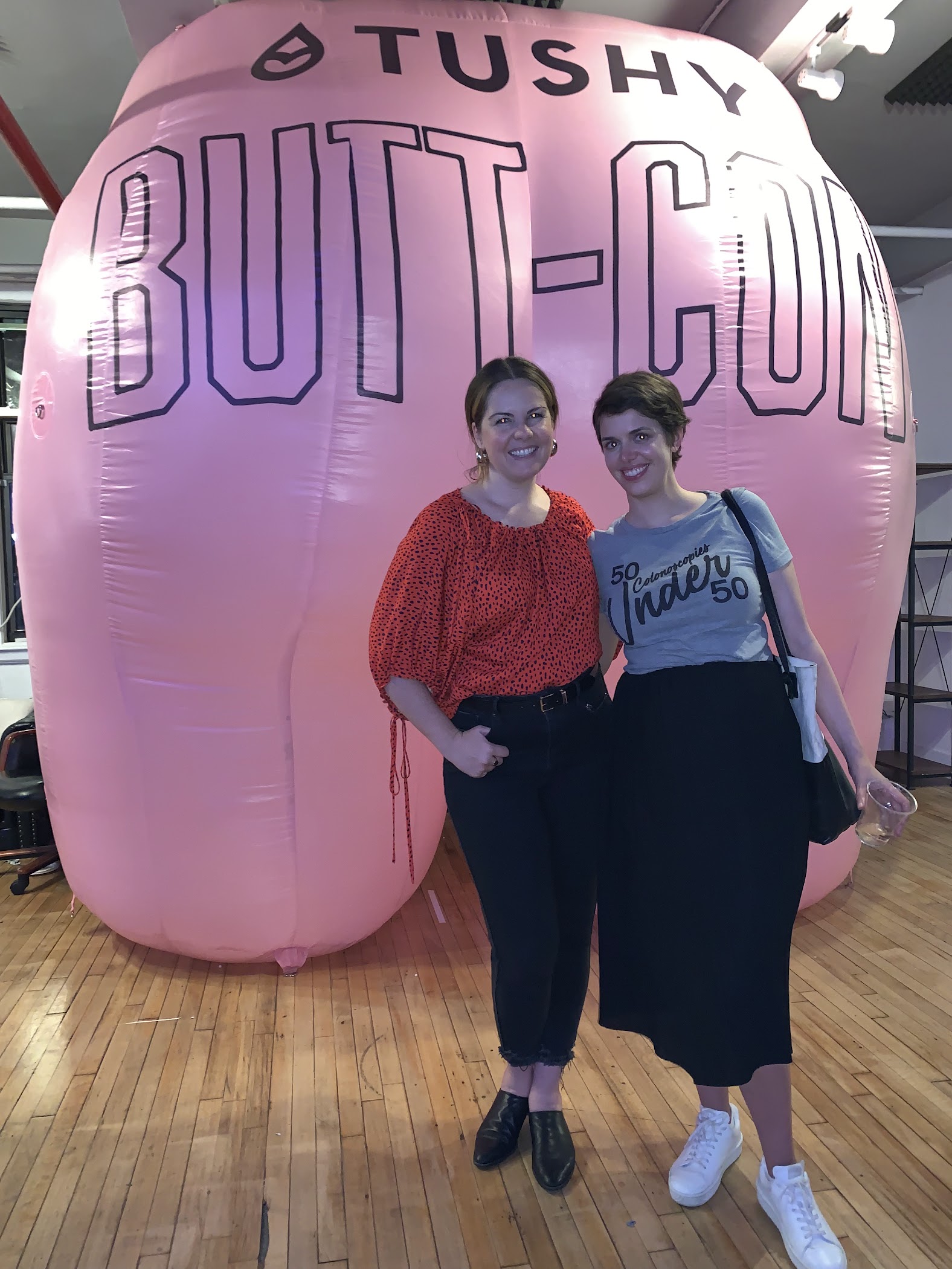 Brooks Bell at Tushy Butt-Con wearing a 50 Colonoscopies Under 50 shirt